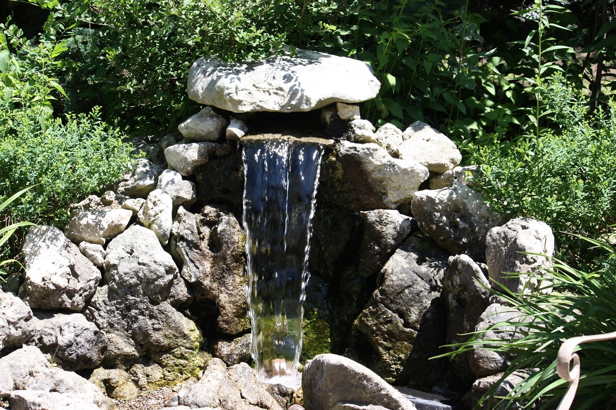 Small Corner Yard Waterfall Pond Idea 1